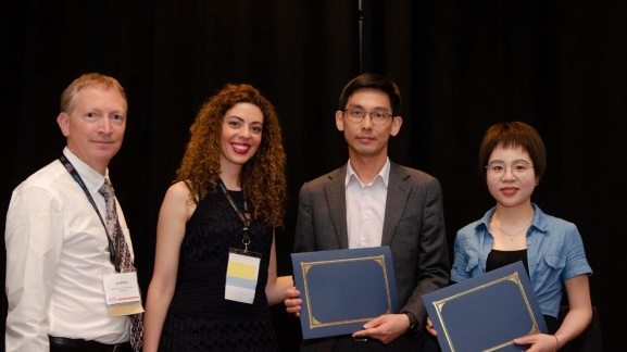 Dr Louis Wong(2nd right) and Ms Yahui Zhang (1st right) received the Best Paper Award from the ARMA President Dr. Joseph P. Morris (1st left) and the 53rd US Rock Mechanics / Geomechanics Symposium Co-Chair Dr Evangelia Ieronymaki (2nd left)